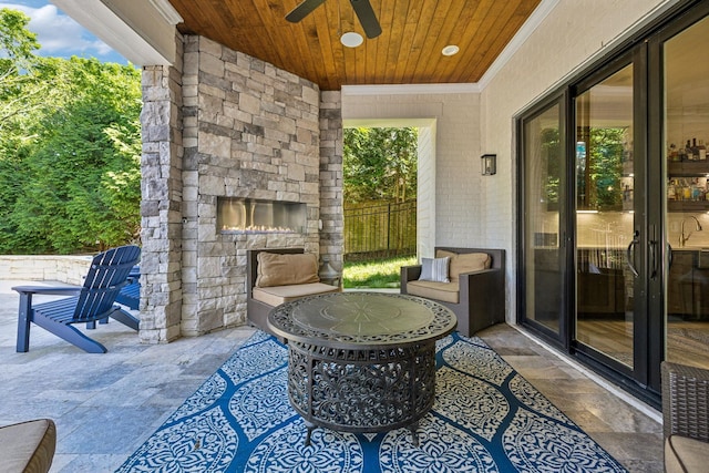 424 Wild Elm St, Franklin, TN 37064 - view of patio / terrace with an outdoor stone fireplace and ceiling fan