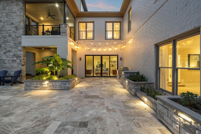 424 Wild Elm St, Franklin, TN 37064 - property entrance with a patio area, brick siding, a balcony, and exterior kitchen