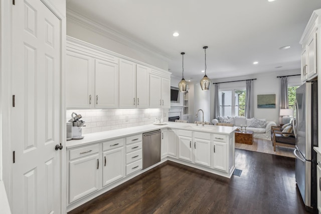 424 Wild Elm St, Franklin, TN 37064 - kitchen featuring a sink, open floor plan, stainless steel appliances, a peninsula, and white cabinetry