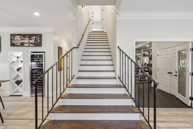 424 Wild Elm St, Franklin, TN 37064 - stairway with ornamental molding, wood finished floors, and recessed lighting