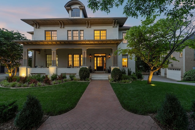 424 Wild Elm St, Franklin, TN 37064 - italianate-style house featuring a porch, brick siding, and a lawn