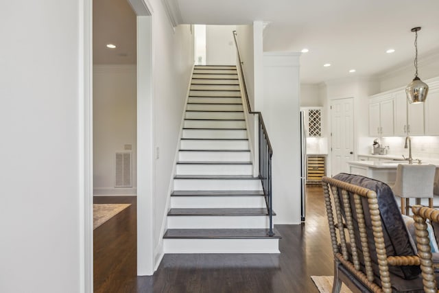 424 Wild Elm St, Franklin, TN 37064 - stairs with ornamental molding, wood finished floors, and recessed lighting