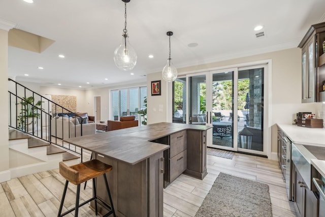 424 Wild Elm St, Franklin, TN 37064 - kitchen with plenty of natural light, a center island, recessed lighting, a breakfast bar, and decorative light fixtures