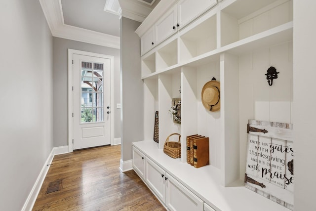8704 Wolfsbane Ln, College Grove, TN 37046 - mudroom with ornamental molding and wood finished floors