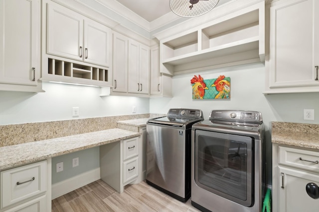 8704 Wolfsbane Ln, College Grove, TN 37046 - laundry room with washer and dryer, cabinet space, ornamental molding, an office area, and light wood finished floors