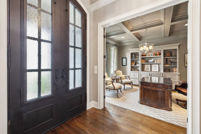 8704 Wolfsbane Ln, College Grove, TN 37046 - foyer with french doors, crown molding, wood finished floors, a chandelier, and beamed ceiling