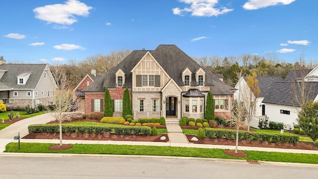 8704 Wolfsbane Ln, College Grove, TN 37046 - view of front facade featuring stone siding and a shingled roof