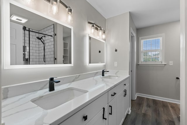 2905 Burtonwood Dr, Spring Hill, TN 37174 - full bath featuring double vanity, wood finished floors, tiled shower, and baseboards
