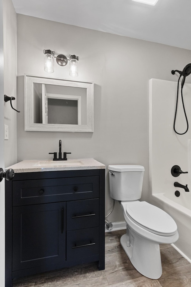 2905 Burtonwood Dr, Spring Hill, TN 37174 - bathroom featuring vanity, toilet, wood finished floors, washtub / shower combination, and baseboards