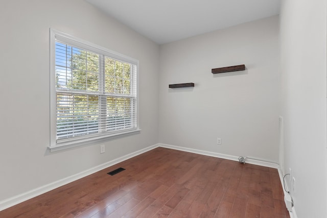 2905 Burtonwood Dr, Spring Hill, TN 37174 - empty room with dark wood-style floors and baseboards