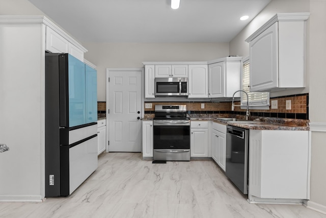 2905 Burtonwood Dr, Spring Hill, TN 37174 - kitchen with appliances with stainless steel finishes, a sink, light marble finish floors, and white cabinetry