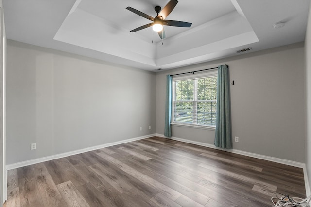 2905 Burtonwood Dr, Spring Hill, TN 37174 - unfurnished room featuring a raised ceiling, a ceiling fan, wood finished floors, and baseboards
