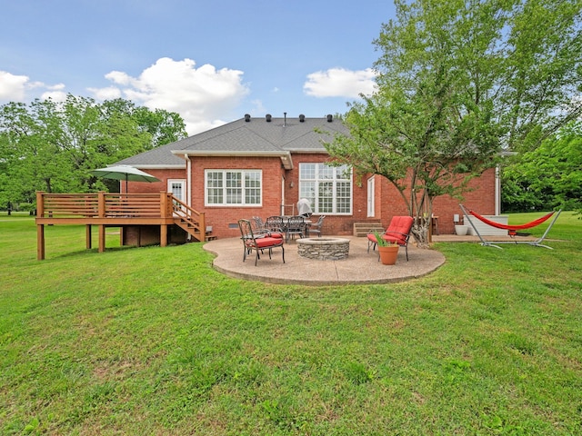 1417 Guill Rd, Mount Juliet, TN 37122 - rear view of house featuring a deck, brick siding, a patio area, and a yard