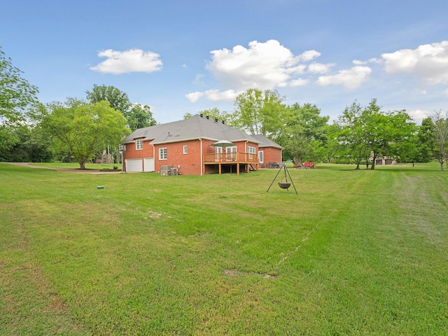 1417 Guill Rd, Mount Juliet, TN 37122 - view of green lawn with a deck, central AC unit, and a garage