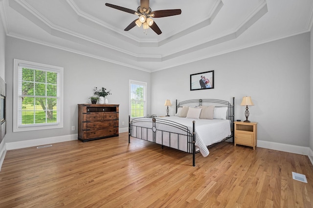 1417 Guill Rd, Mount Juliet, TN 37122 - bedroom featuring a raised ceiling, light wood-type flooring, ornamental molding, and baseboards