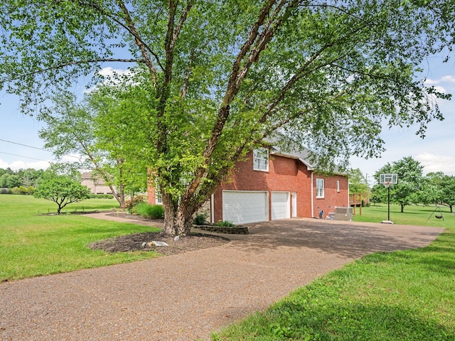 1417 Guill Rd, Mount Juliet, TN 37122 - view of home's exterior with a lawn, a garage, brick siding, and driveway