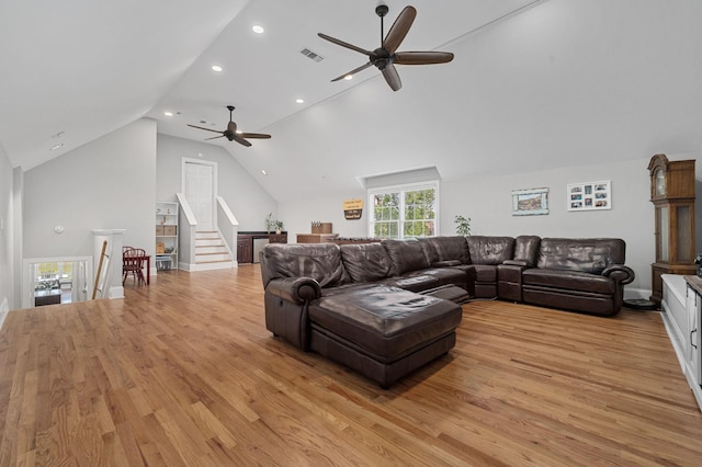 1417 Guill Rd, Mount Juliet, TN 37122 - living area featuring ceiling fan, light wood-style floors, vaulted ceiling, recessed lighting, and stairs
