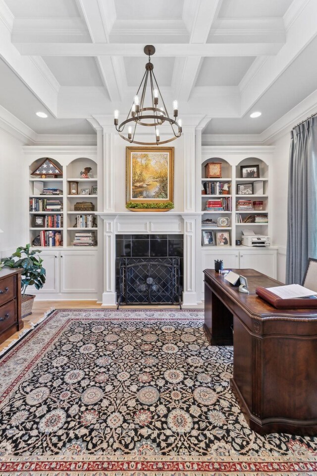 4043 Old Light Cir, Arrington, TN 37014 - home office with beam ceiling, built in shelves, a tiled fireplace, a chandelier, and crown molding