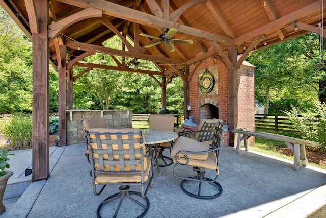3285 Blazer Rd, Franklin, TN 37064 - view of patio / terrace with an outdoor brick fireplace, a gazebo, outdoor dining space, and ceiling fan