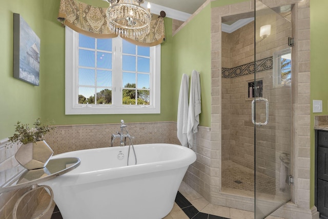 3285 Blazer Rd, Franklin, TN 37064 - bathroom featuring a freestanding bath, a stall shower, plenty of natural light, wainscoting, and a chandelier