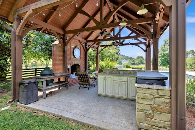 3285 Blazer Rd, Franklin, TN 37064 - view of patio / terrace featuring a gazebo, an outdoor kitchen, an outdoor brick fireplace, and ceiling fan