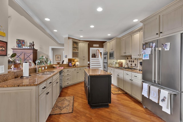 3285 Blazer Rd, Franklin, TN 37064 - kitchen with stainless steel appliances, a sink, open shelves, a peninsula, and crown molding