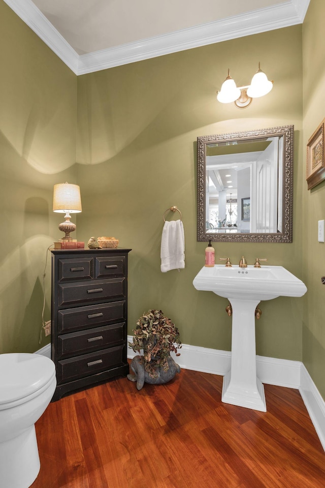 3285 Blazer Rd, Franklin, TN 37064 - bathroom with wood finished floors, toilet, crown molding, and baseboards