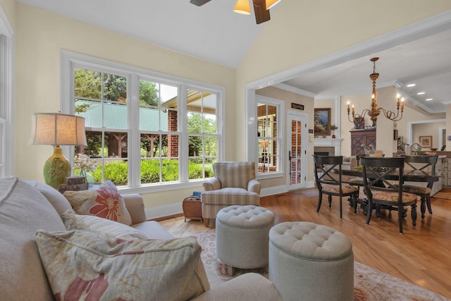 3285 Blazer Rd, Franklin, TN 37064 - living room featuring plenty of natural light, wood finished floors, a chandelier, ceiling fan, and ornamental molding