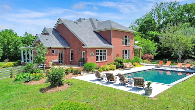 3285 Blazer Rd, Franklin, TN 37064 - back of house featuring a patio area, brick siding, an outdoor pool, and roof with shingles