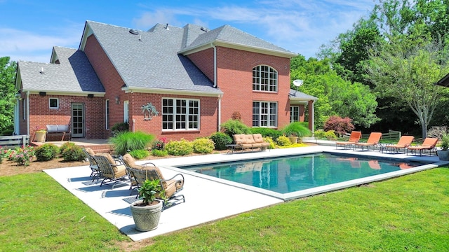3285 Blazer Rd, Franklin, TN 37064 - back of house with a patio, brick siding, a yard, and an outdoor pool