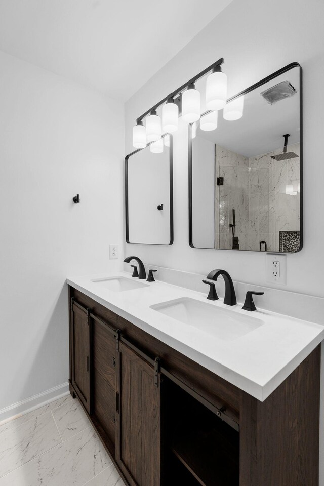 104 Dolphus Dr, Hendersonville, TN 37075 - bathroom with double vanity, a marble finish shower, marble finish flooring, and baseboards