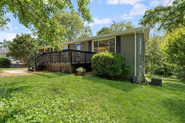 104 Dolphus Dr, Hendersonville, TN 37075 - view of front facade with a deck, a front yard, cooling unit, and brick siding