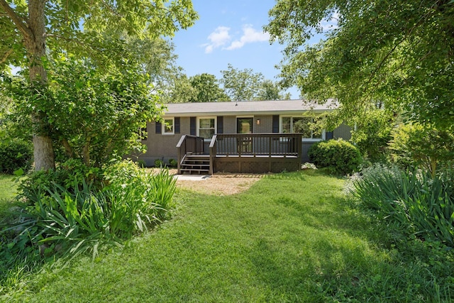 104 Dolphus Dr, Hendersonville, TN 37075 - back of property with a lawn and a wooden deck