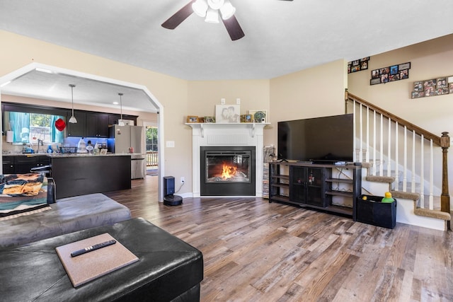 1710 Collins Hollow Rd, Lewisburg, TN 37091 - living area with wood finished floors, ceiling fan, stairs, and healthy amount of natural light