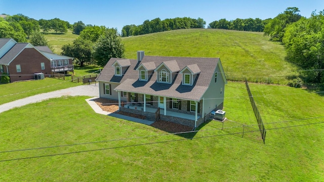 1710 Collins Hollow Rd, Lewisburg, TN 37091 - view of front of home featuring covered porch, a chimney, driveway, central air condition unit, and a view of countryside