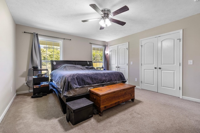1710 Collins Hollow Rd, Lewisburg, TN 37091 - bedroom featuring multiple closets, carpet flooring, baseboards, ceiling fan, and a textured ceiling