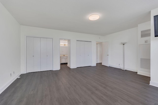6666 Brookmont Ter Unit 307, Nashville, TN 37205 - unfurnished bedroom featuring dark wood-style floors and baseboards