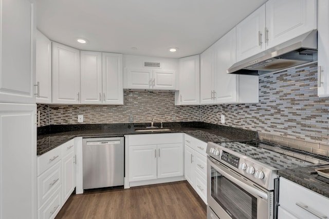 6666 Brookmont Ter Unit 307, Nashville, TN 37205 - kitchen with stainless steel appliances, under cabinet range hood, a sink, white cabinets, and recessed lighting
