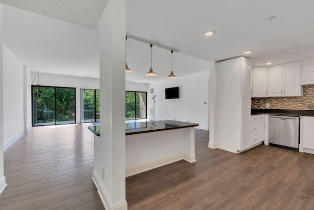 6666 Brookmont Ter Unit 307, Nashville, TN 37205 - kitchen featuring stainless steel dishwasher, dark countertops, dark wood finished floors, open floor plan, and baseboards