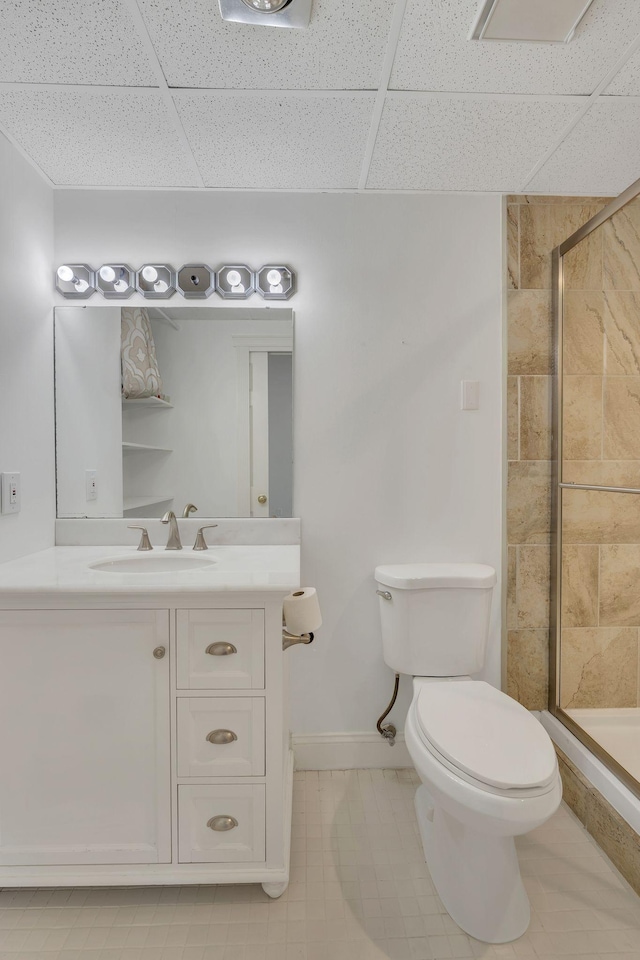 6666 Brookmont Ter Unit 307, Nashville, TN 37205 - full bathroom with toilet, tiled shower, vanity, a drop ceiling, and baseboards