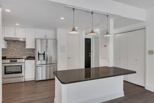 6666 Brookmont Ter Unit 307, Nashville, TN 37205 - kitchen with stainless steel appliances, under cabinet range hood, dark wood-style flooring, recessed lighting, and dark countertops