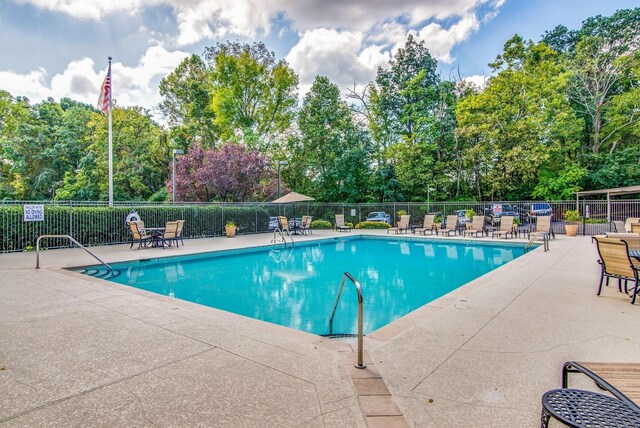 6666 Brookmont Ter Unit 307, Nashville, TN 37205 - community pool with a patio and view of scattered trees