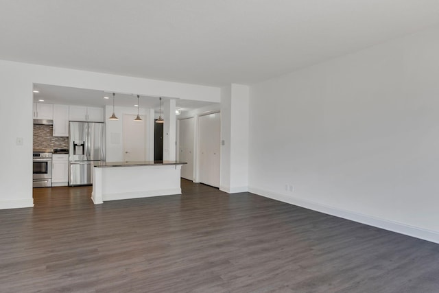 6666 Brookmont Ter Unit 307, Nashville, TN 37205 - unfurnished living room with dark wood-style floors and baseboards