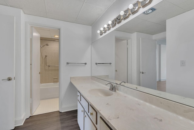 6666 Brookmont Ter Unit 307, Nashville, TN 37205 - full bathroom featuring vanity, a paneled ceiling, wood finished floors, shower / bathtub combination, and baseboards