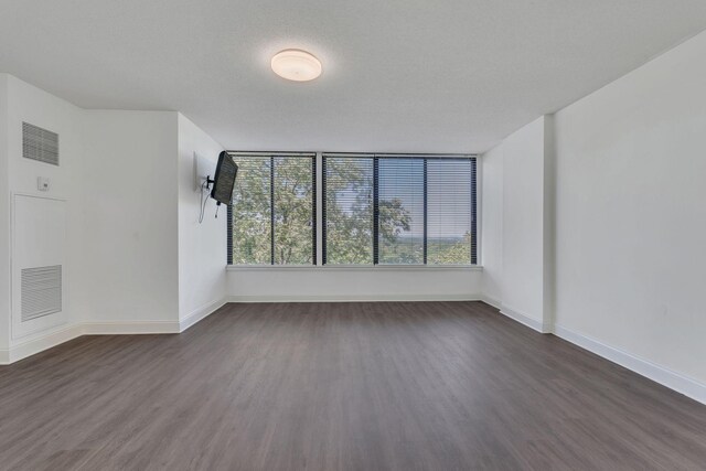 6666 Brookmont Ter Unit 307, Nashville, TN 37205 - empty room featuring dark wood-style flooring and baseboards