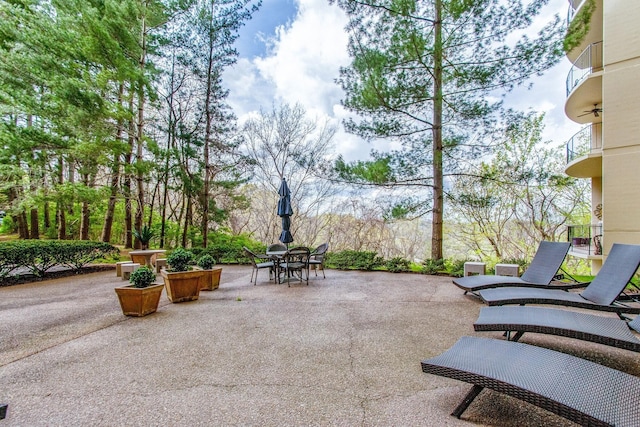 6666 Brookmont Ter Unit 307, Nashville, TN 37205 - view of patio featuring outdoor dining space and a balcony