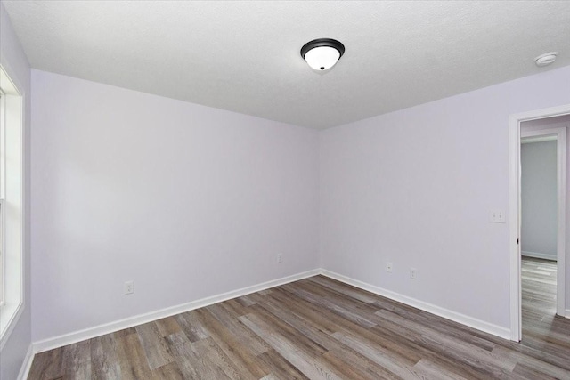 1161 Honey Ln, Estill Springs, TN 37330 - spare room with wood finished floors and a smoke detector