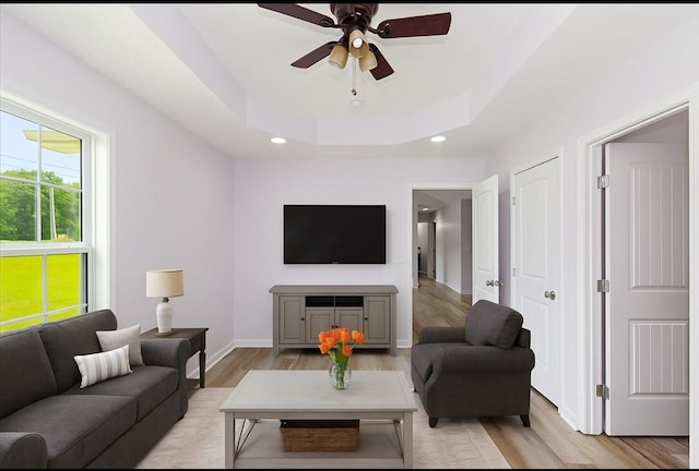 1161 Honey Ln, Estill Springs, TN 37330 - living room with light wood-style floors, a tray ceiling, a ceiling fan, and recessed lighting