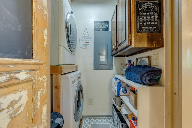 1930 Preacher Holt Rd, Mount Pleasant, TN 38474 - laundry room with electric panel, stacked washer / dryer, cabinet space, and baseboards