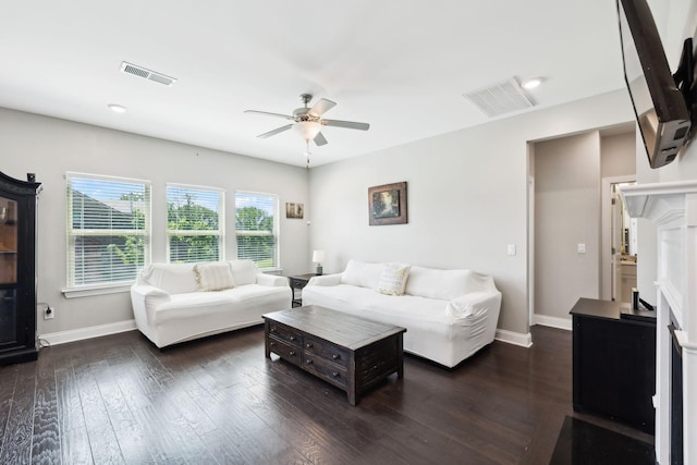 633 Fall Creek Cir, Goodlettsville, TN 37072 - living area featuring a ceiling fan, baseboards, a fireplace, and dark wood-style flooring
